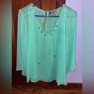 Super cute Jennifer Lopez fancy top with open back